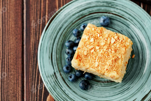 Preview: Piece of cake Napoleon on green plate