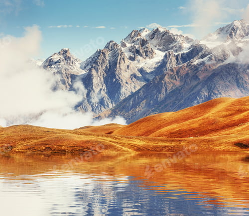 Preview: Snow-covered mountains in the mist. Autumn at Koruldi Lake.
