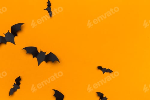 Preview: halloween and decoration concept - paper bats flying