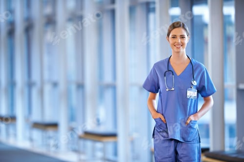 Preview: Ready to help. Portrait of a happy young doctor standing in a hospital hallway.