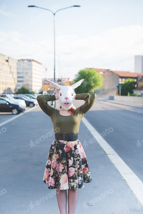 Preview: young woman beautiful outdoor wearing rabbit mask