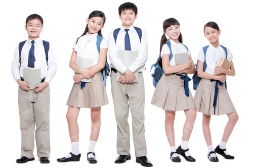 Preview: Happy primary school friends with books and schoolbags