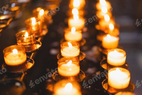 Preview: Many Candles burning in a cathedral. Religious ritual in the church.
