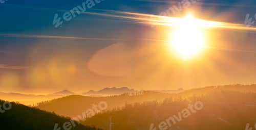 Preview: Panoramic dreamy view of sunrise above mountains