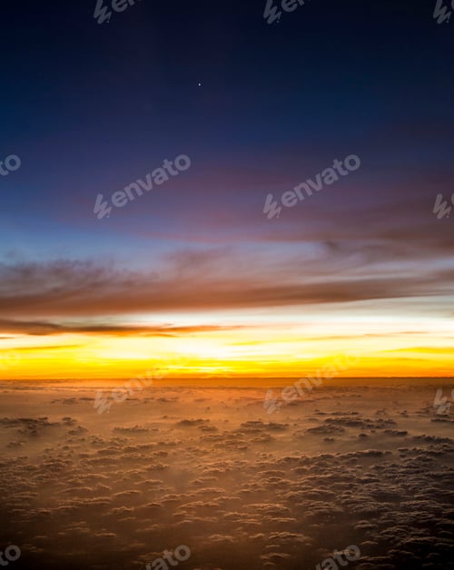 Preview: A solitary star twinkles above a fiery horizon, where day meets night in a dance of clouds.