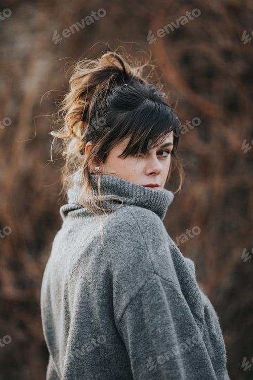 Preview: Woman with Messy Bun and Turtleneck Sweater