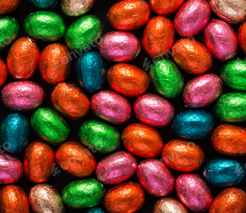 Preview: Colorful Easter eggs background. Chocolate Easter eggs texture. Top view