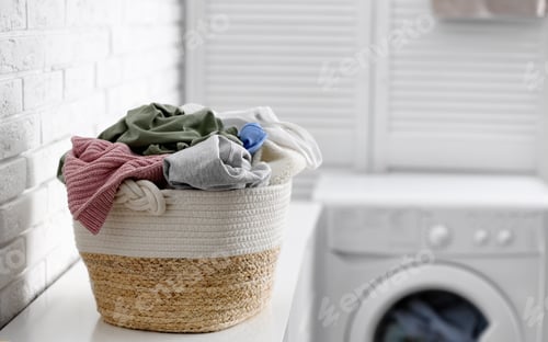 Preview: Wicker basket with dirty laundry indoors, space for text