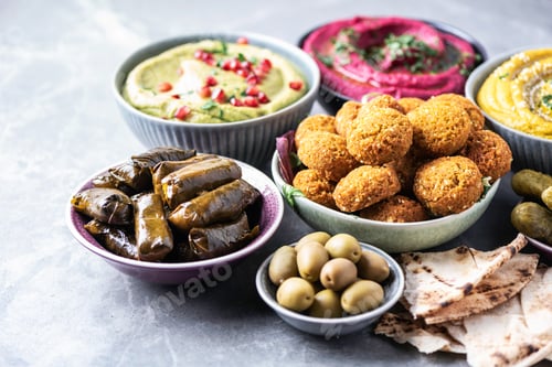 Preview: Traditional Middle Eastern assorted meze: hummus, pita, olives, pistachios, dolma, falafel balls