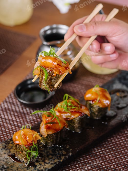 Preview: girl eats Japanese sushi gunkan salmon