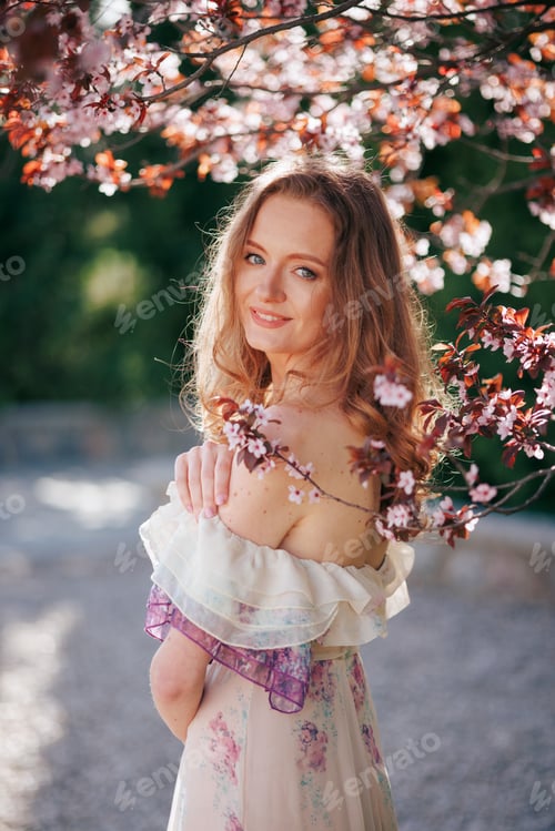 Preview: Joyful Woman Among Cherry Blossoms