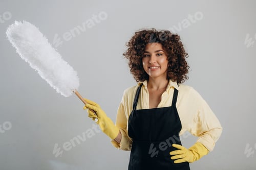 Preview: Housewife is ready to clean the house. Beautiful woman is in the studio