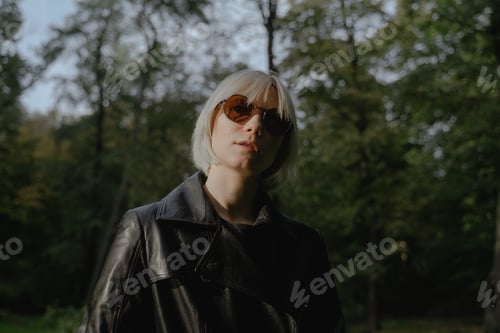 Preview: portrait of a girl with round glasses and white hair