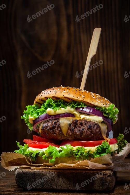 Preview: Restaurant Burger with Salad and Sauce on Wooden Background