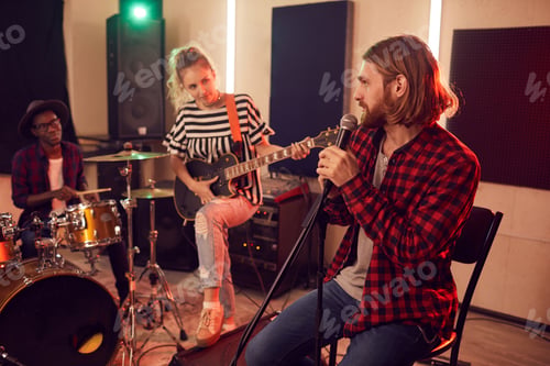Preview: Group of Young People Playing Music in Studio
