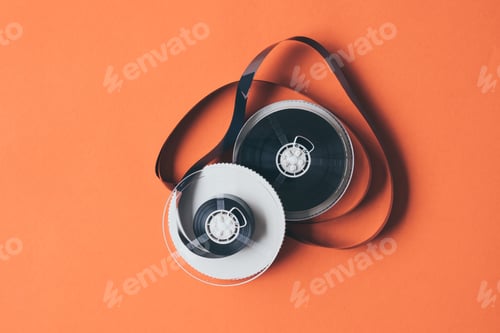 Preview: Film for video cassette tape on orange background.