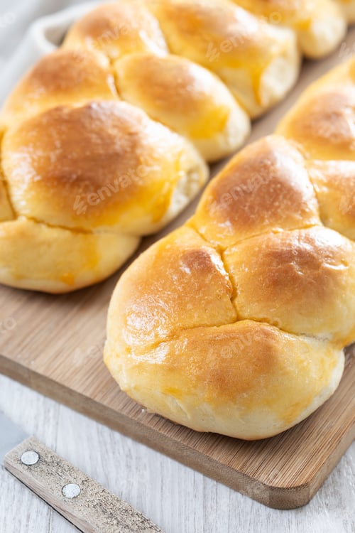 Preview: Traditional Easter braided bread. Tsoureki braid on wooden table