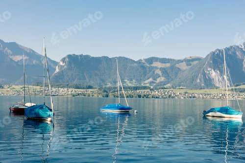 Preview: lake with yachts and mountains landscape