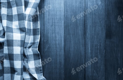 Preview: Blue and White Plaid Cloth on Wooden Background