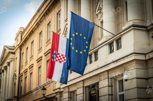 Preview: Croatian and EU flags hanging outside the Croatian Parliament Palace in Zagreb, Croatia