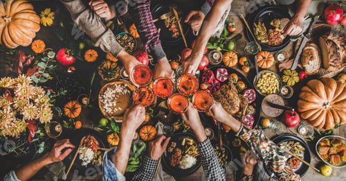 Preview: Family celebrating Thanksgiving day with Autumn food and rose wine