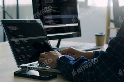 Computer programmer working on new software program.