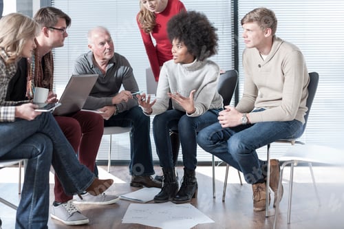 Preview: Colleagues in office having an informal meeting