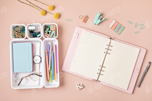 Preview: Modern workspace with notebook, office stationary in plastic organizers