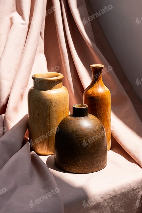 Preview: Wooden vases on textile background. Aesthetic vintage home decor collection.