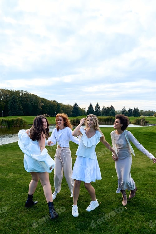 Preview: Four friends celebrate spring in stylish outfits in a beautiful outdoor park setting