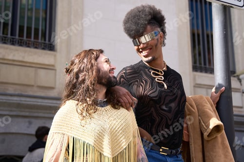 Preview: Gay couple smiling and sharing a moment of love and complicity
