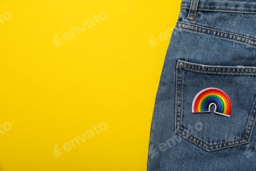 Preview: LGBT parade concept, free love symbol on yellow background.