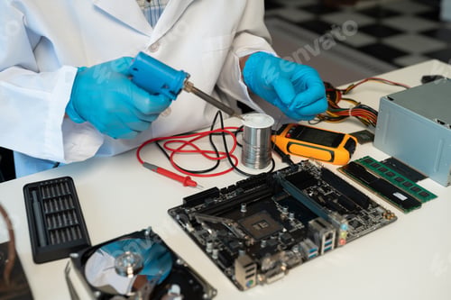 Preview: Close up of Technician measuring voltage electronic circuit board