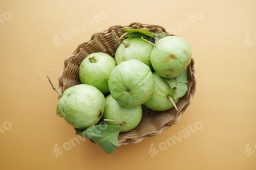 Preview: top view of many guava in a bowl on table