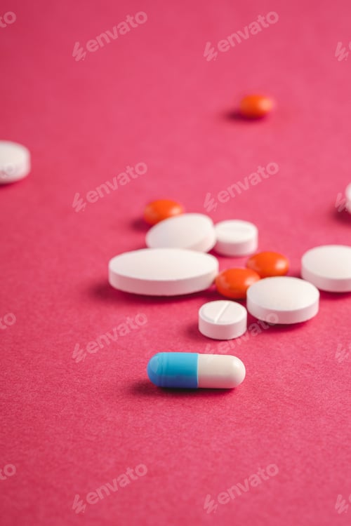 Preview: Pills and tablets on pink background, healthcare medical concept, antibiotics and cure