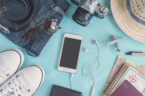 Preview: Outfit of traveler on green background with copy space