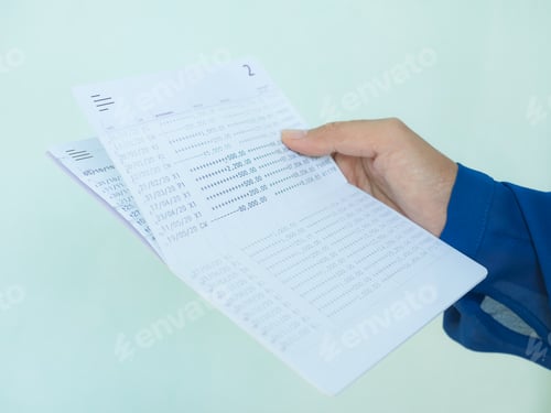 Preview: Hand holding Bank Account Book Statement Balance Number