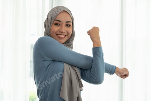Preview: Portrait beautiful young muslim asian woman doing exercise at home.