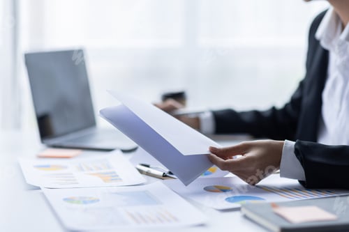 Preview: Asian female accountant or banker making calculations. Young business asian woman in workplace,