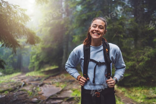 Preview: A person running through a misty forest, navigating over tree roots and muddy ground. The scene capt