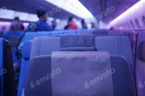 Preview: purple color Empty passenger airplane seats in the cabin