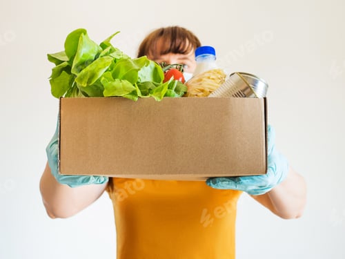 Preview: Woman in face mask with food delivery box