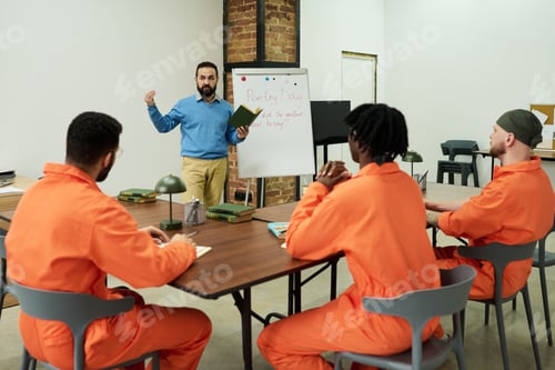 Preview: Male Teacher Instructing Group of Incarcerated Young Adult Men in Classroom