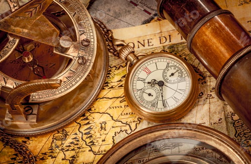 Preview: Vintage style travel and adventure. Vintage old compass and other vintage items on the table.