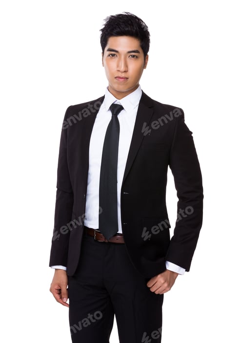 Man in Suit and Tie Posing Professionally