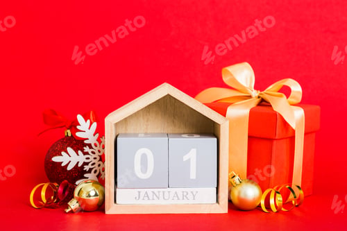Preview: 1 january. Christmas composition on colored background with a wooden calendar