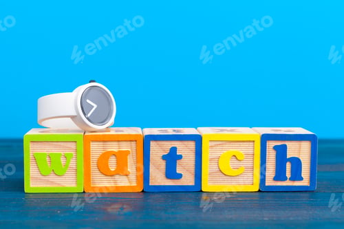 Preview: cube wooden block with alphabet building the word watch
