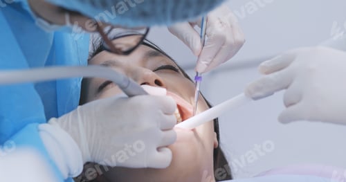 Preview: Dentist examines the patient teeth