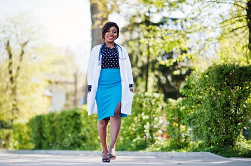 Preview: Confident Woman Doctor in City Park Smiling