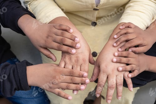 Preview: Family hands connecting showing generation support